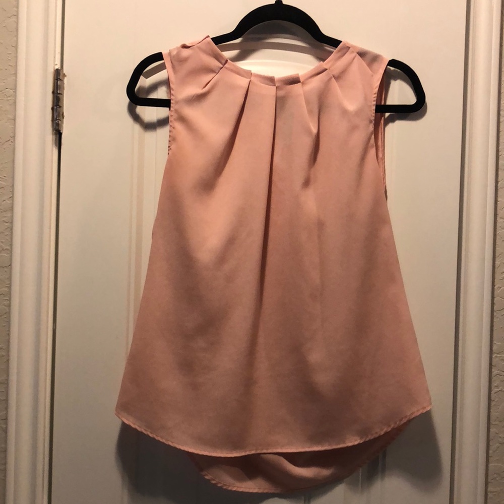Pink sleeveless blouse